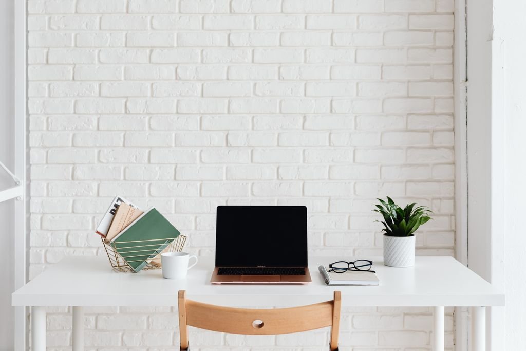No drill home office organization ideas for renters with an organized desk against a brick wall